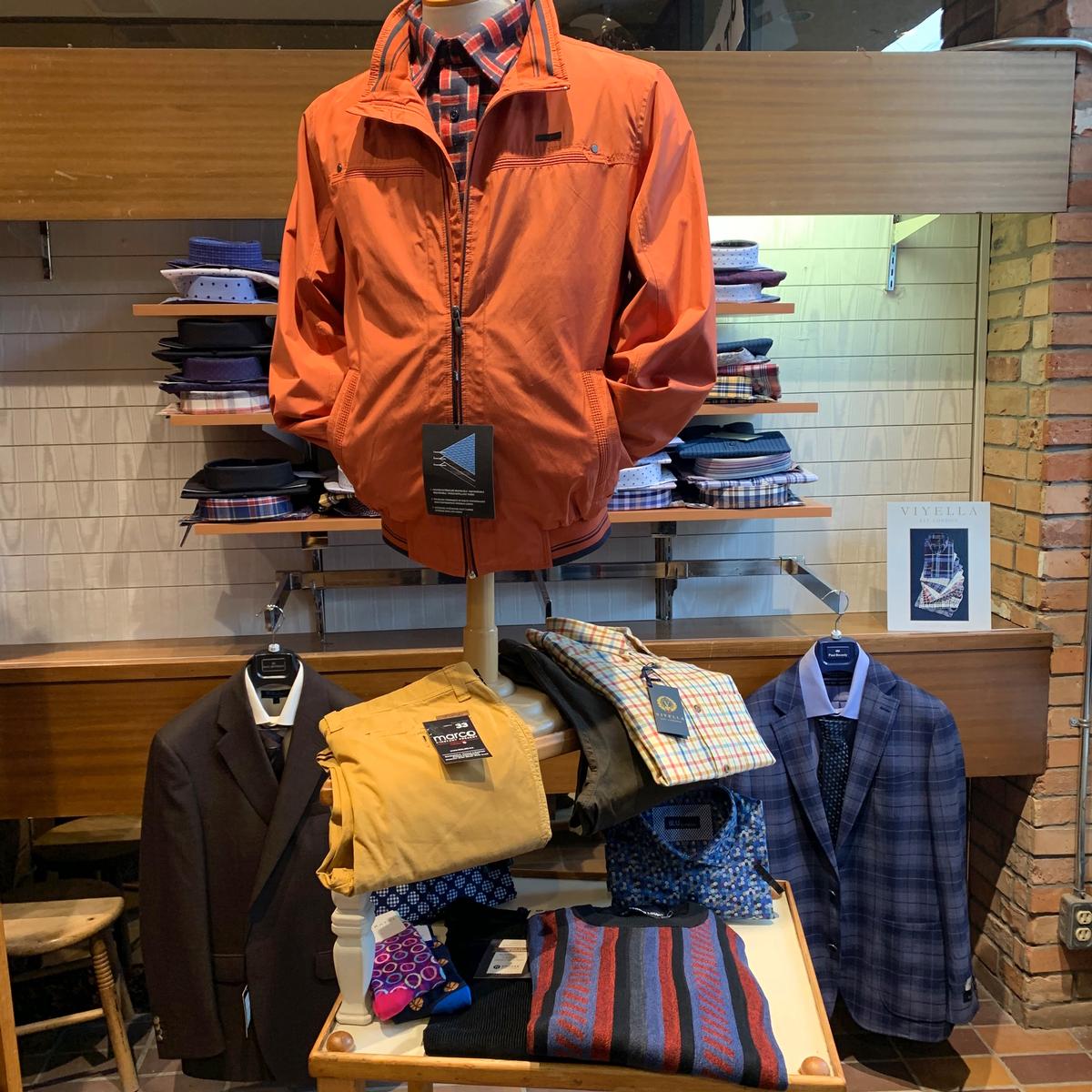 Menswear display with jackets and casual wear at Dapper Depot